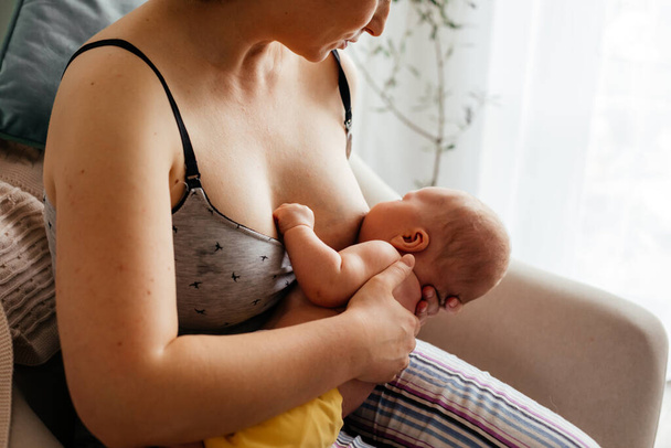 Mom and newborn baby resting after breastfeeding - 写真・画像