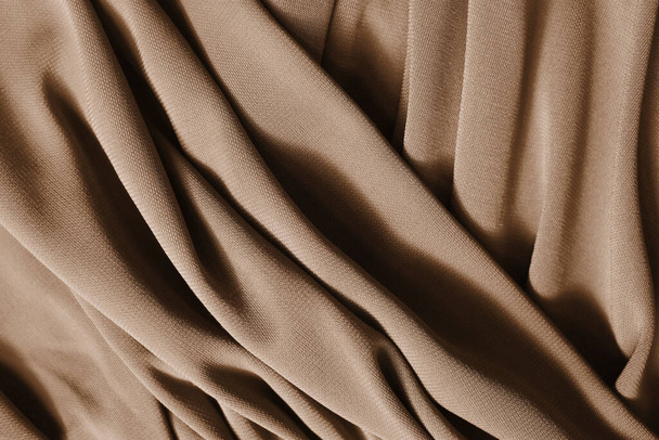 Smooth elegant beige satin texture can use as abstract background. Luxurious background design. Closeup texture - 写真・画像