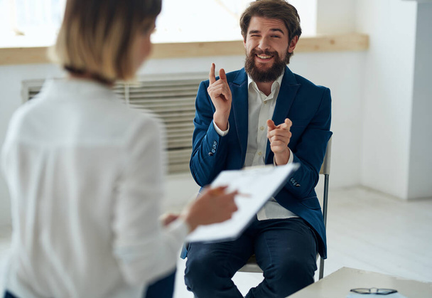 man communicates with woman job interview office emotions - Foto, Bild