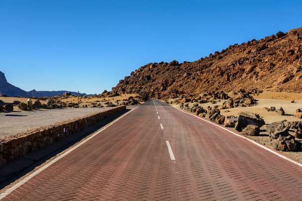 Beautiful Country roads and nature. Teide in the middle of the road. moon landscape. desert landscape in Teide National Park, Tenerife Island, Canary Islands, Spain - Photo, Image