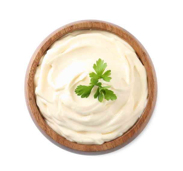 Bowl with delicious mayonnaise and parsley isolated on white, top view - Fotó, kép