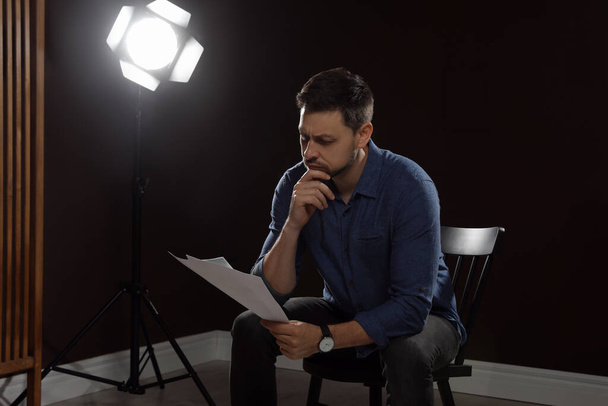 Professional actor reading his script during rehearsal in theatre - Foto, Imagem
