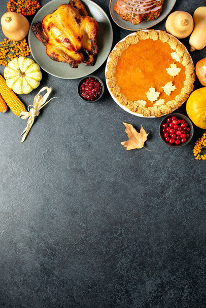 Thanksgiving traditional food for festive charity or family and friends dinner party, top-down view, blank space for a greeting text - Photo, Image