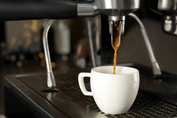 Making fresh aromatic espresso using professional coffee machine - Fotoğraf, Görsel
