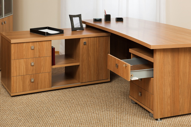 wooden desk with an open drawer in the office - Foto, Imagen