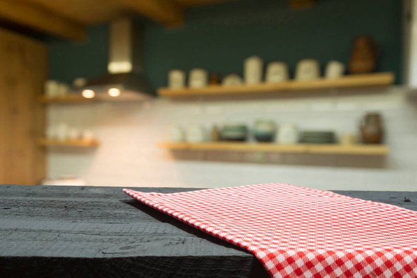 Checkered napkin on wooden background - Фото, зображення