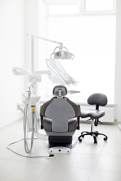 Dentist's office interior with modern chair and special dentisd equipment - Φωτογραφία, εικόνα