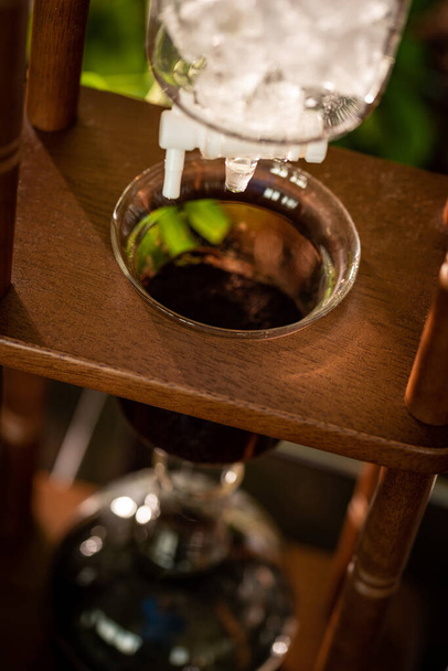 cold drip coffee tower with soft-focus and over light in the background - 写真・画像