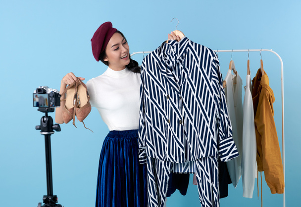 Asian young woman live streaming for sale fashion clothing is blogger presenting for social people.Her is influencer in social online.	 - Φωτογραφία, εικόνα