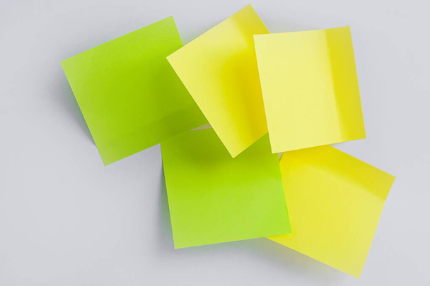 yellow, green sticky note on white background. Color paper note. Back to school minimal concept - Fotografie, Obrázek