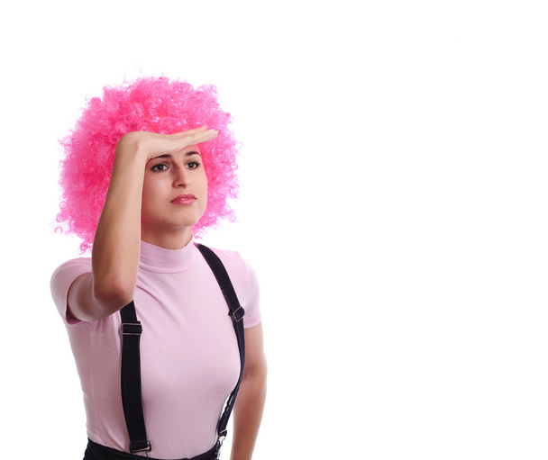 Girl in pink wig watching around, isolated on white - Foto, Imagen