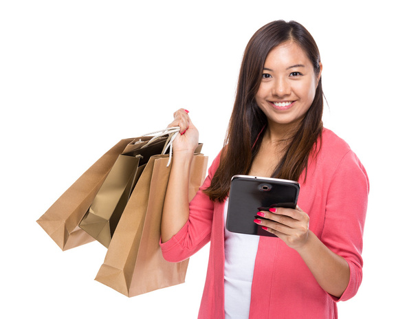 Asian woman with tablet and shopping bag - Fotó, kép