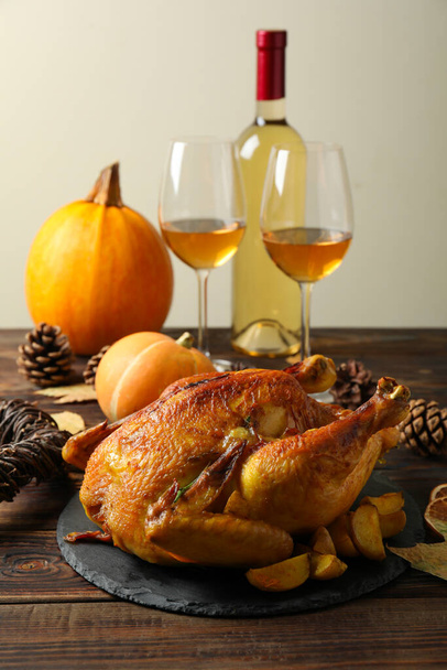 Thanksgiving Day roast turkey on wooden table - Fotó, kép