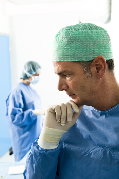 Portrait of a male surgeon, in tha background - Photo, image