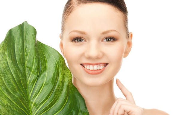 Picture of woman with green leaf over white - Foto, Imagem