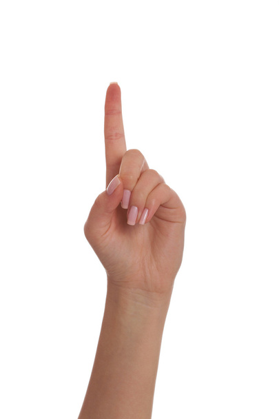 Female hand pointing up - Фото, изображение
