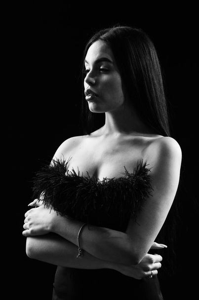 Sexual hint. Beautiful decollete. Fashion concept. Fancy clothes. Fashion shop. Attractive woman fashion model. Fashionable girl wearing dress with feathers. Seductive lady. Emphasize sexuality - Photo, image