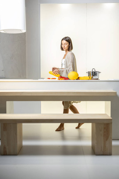 Woman cooking healthy at modern kitchen - Fotoğraf, Görsel