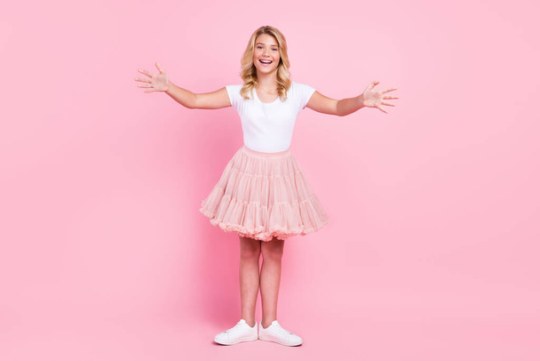Full length photo of young attractive girl happy positive smile pose open arms ballerina isolated over pastel color background - 写真・画像