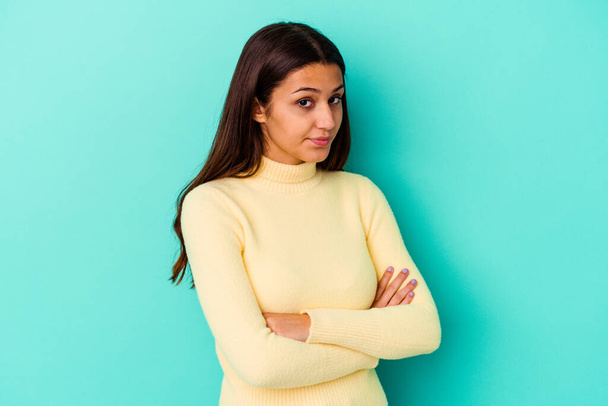 Young Indian woman isolated on blue background unhappy looking in camera with sarcastic expression. - Photo, Image