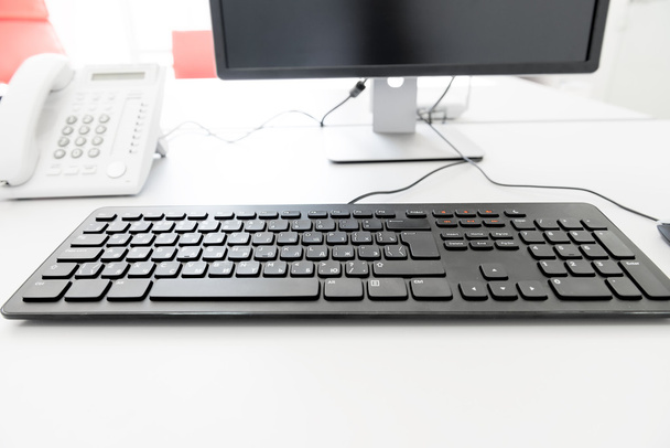 black keyboard on the desk in the office manager - Photo, Image