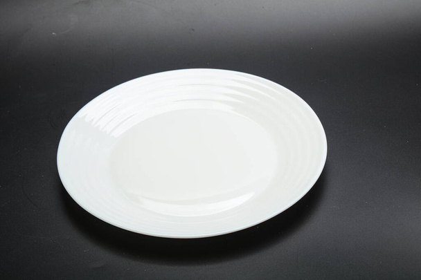 White proclean bowl for serving over black - Foto, immagini