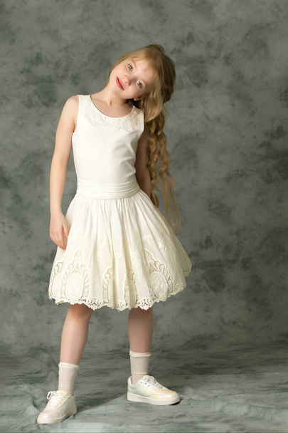 Elegant girl in a dress. Youth fashion concept, happy child. - Zdjęcie, obraz