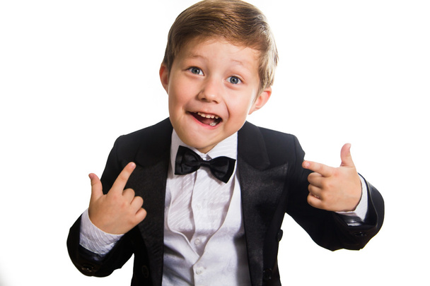 Cheerful boy in a tuxedo, isolation - Фото, изображение