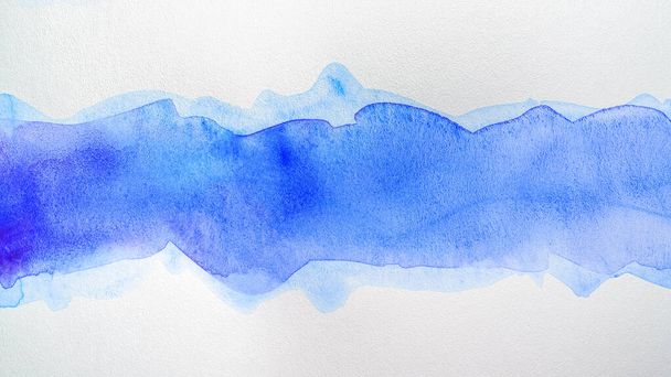 Element of watercolor paint with a blue stripe in the middle of the watercolor. High resolution texture of paper with paint - Photo, image