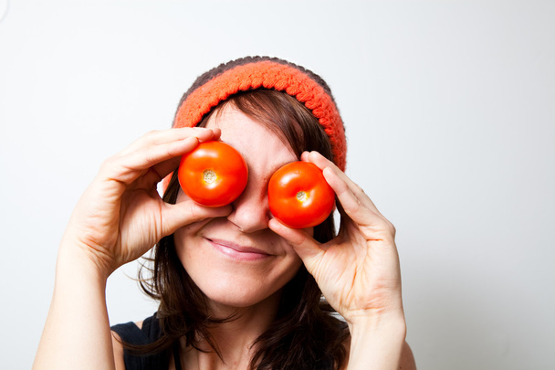 Young woman with tomato eyes. Studio shot. - Foto, immagini