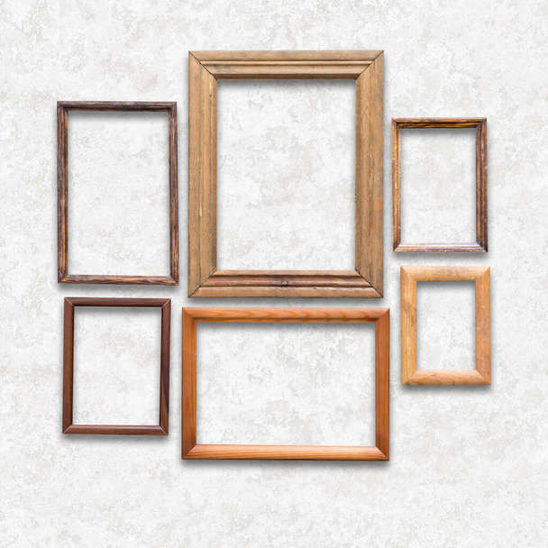 wooden photo frames on white wall - Photo, Image