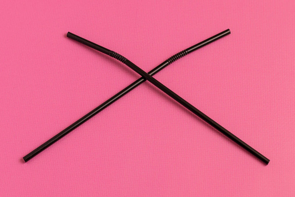 Plastic straws for drinking. On a pink background. Stop plastic concept. - Photo, Image