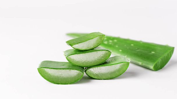 Aloe vera plant leaves and slices isolated on white background. Aloe vera for natural cosmetics and alternative medicine. - Photo, Image