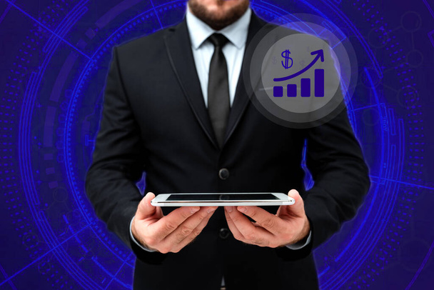 Man In Office Uniform Standing Holding Tablet Displaying New Modern Technology. Gentleman In Business Attire Carrying Tab Pointing New Futuristic Technology. - Photo, Image