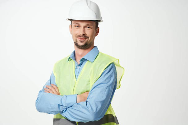 Male builder Professional working uniform light background - Φωτογραφία, εικόνα