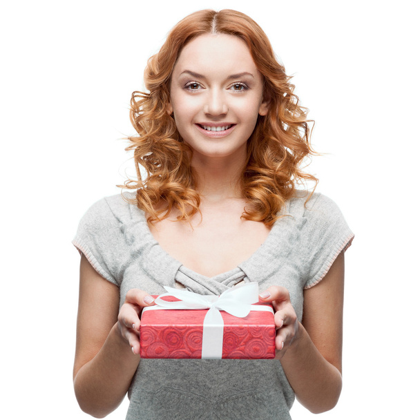 young casual woman hoding christmas gift - Foto, immagini