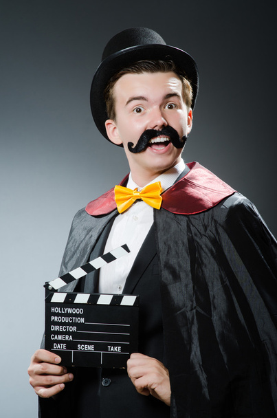 Funny man with movie clapper board - Photo, Image