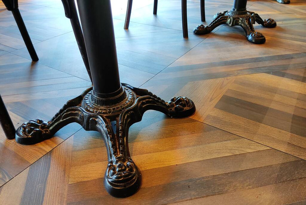 dark brown wood parquet floor background with asymmetrical intersecting stripes triangles and lines - Foto, immagini