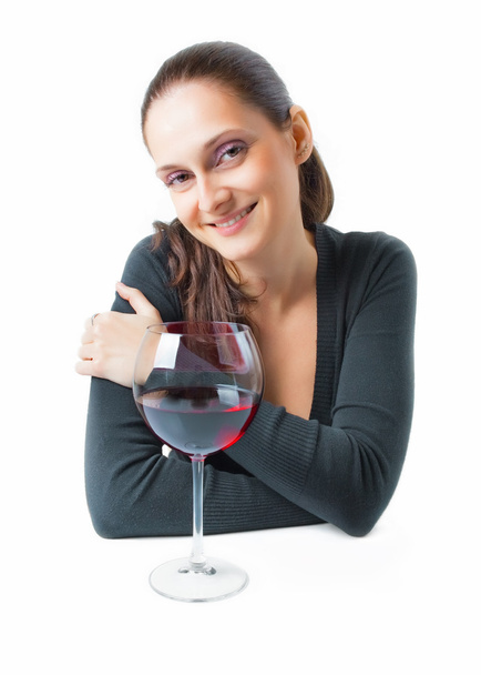 Gyönyörű fiatal hölgy egy bájos mosollyal és puha pihentető kifejezés egy pohár vörös bor elszigetelt fehér background - Fotó, kép
