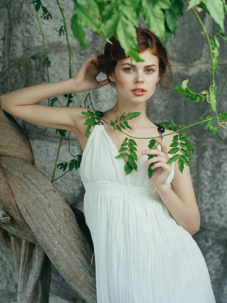attractive red-haired Woman in white dress mythology decoration posing - Fotografie, Obrázek