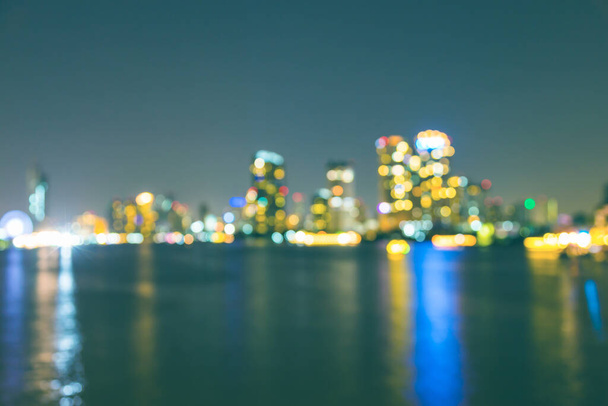lehký bokeh města na řece v noci na pozadí - Fotografie, Obrázek