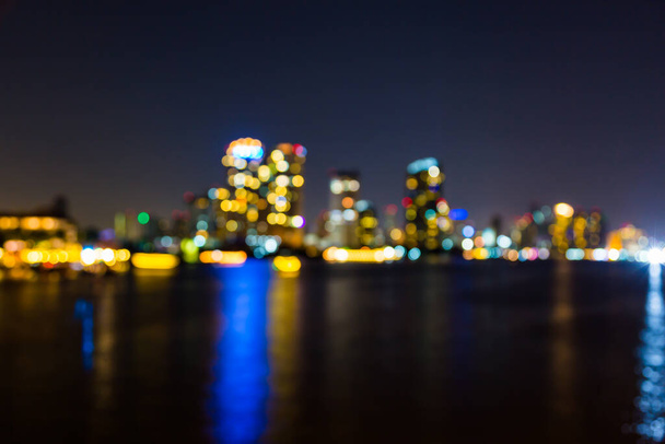 light bokeh of city on the river at night background - Фото, изображение