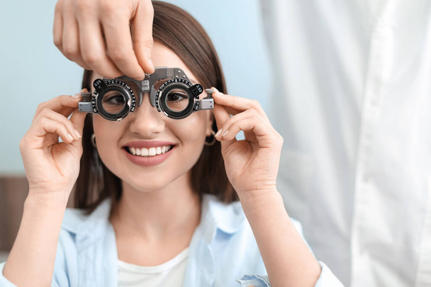 Young woman visiting ophthalmologist in clinic - Photo, Image