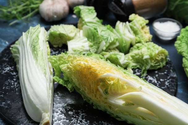 Fresh chinese cabbage and spices on color background, closeup - Photo, Image