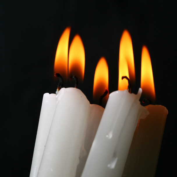 Sacred candles in dark on black background - Foto, Imagem