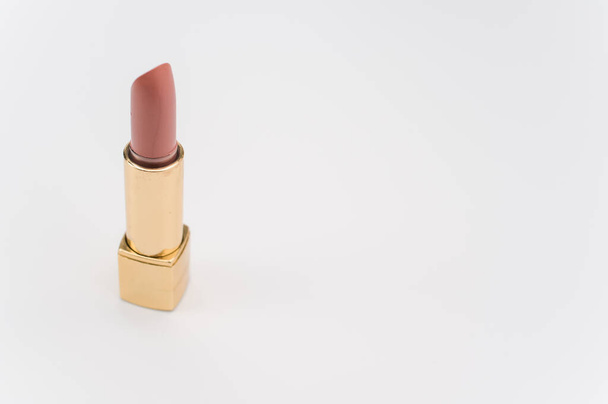 A high angle shot of a nice lipstick on a white surfa - Valokuva, kuva