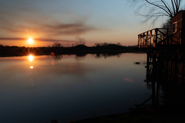 A beautiful sunset on a lake scape - Photo, image