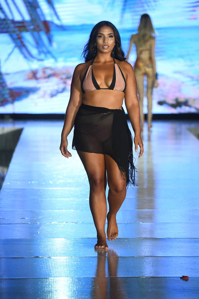 MIAMI BEACH, FLORIDA - JULY 10: A model walks the runway for Swim with poppies Show during Miami Swim Week The Shows powered by DCSW on July 10, 2021 in Miami Beach, Florida - Photo, Image