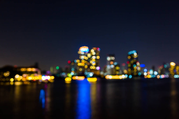 light bokeh of city on the river at night background - 写真・画像