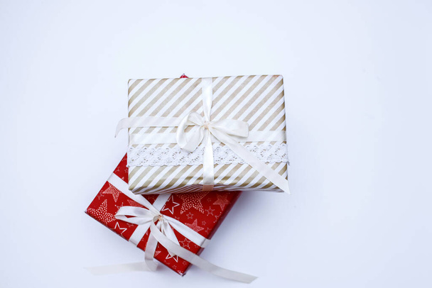 New Years gifts in red and white packaging. - Foto, Imagem
